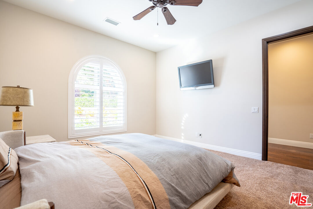 2510 Belleview Road Upland, CA 91784 - Photo 65 of 75 a bedroom with a bed and a flat screen tv