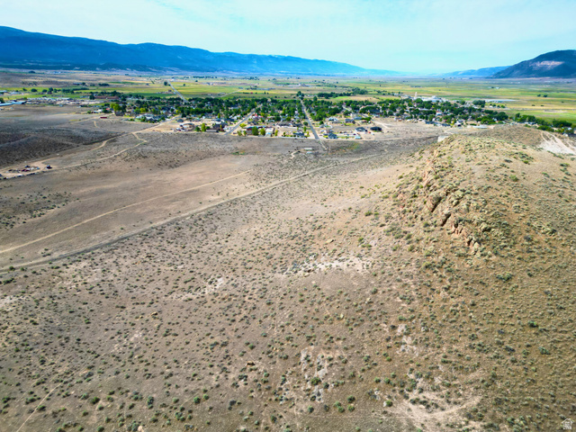 600 East E Street Moroni, UT 84646 - Photo 20 of 38 Expansive arid terrain featuring a prominent rocky outcrop and distant mountain ranges