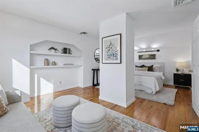 a spacious bedroom with a bed and a couch