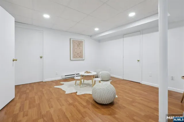 a hallway with a table and a chair