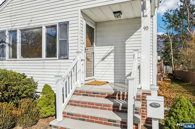 a view of a balcony with potted plants