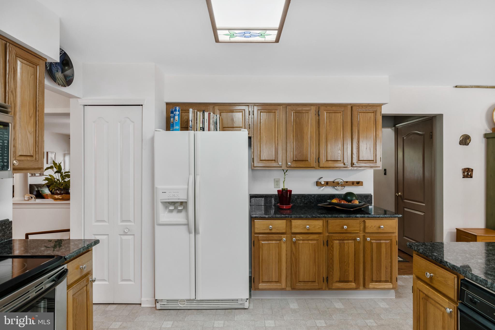 10 Tansgate Boulevard Berlin, NJ 08009 - Photo 15 of 51 a kitchen with stainless steel appliances a refrigerator sink and stove
