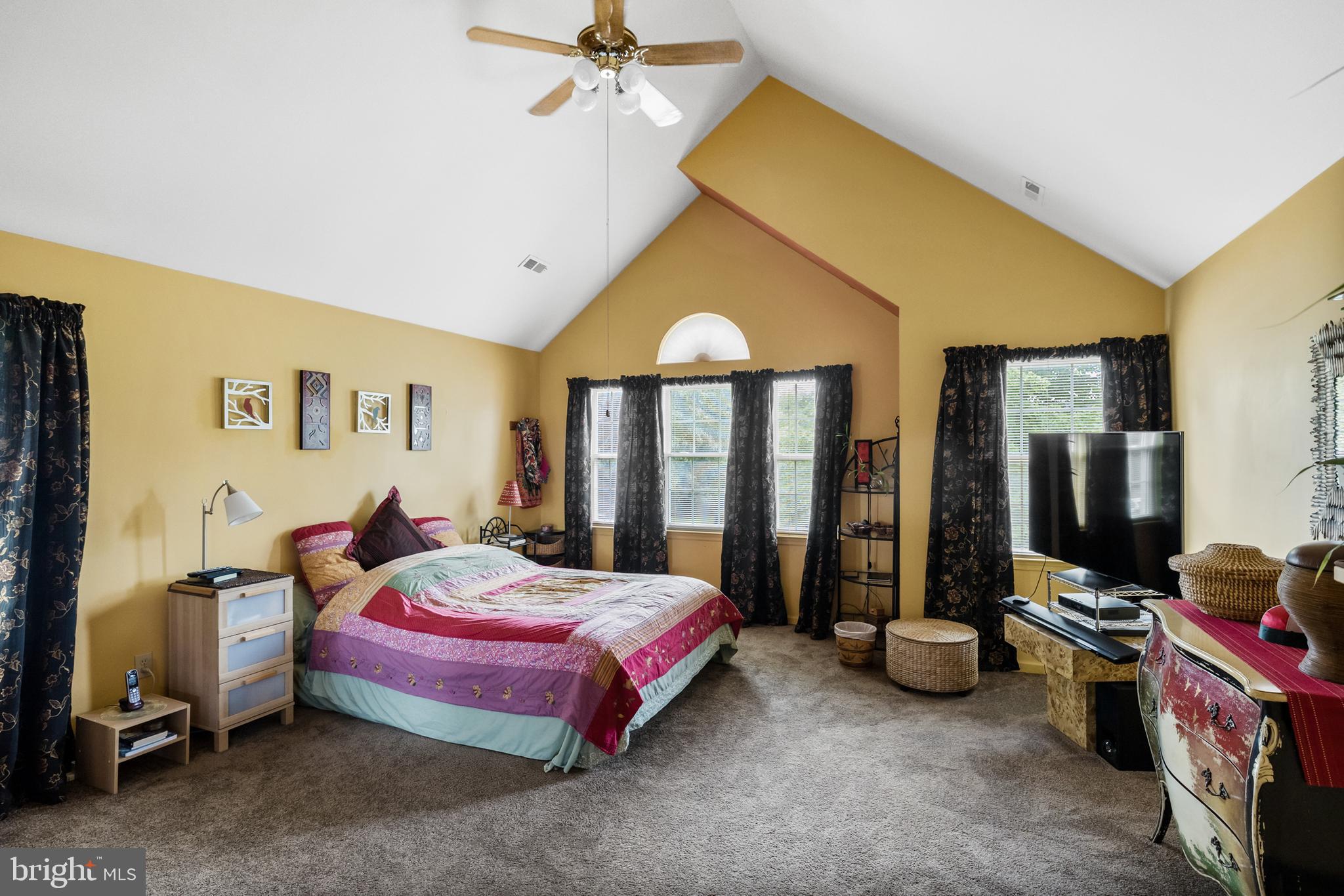 10 Tansgate Boulevard Berlin, NJ 08009 - Photo 23 of 51 a bedroom with a bed and a chandelier