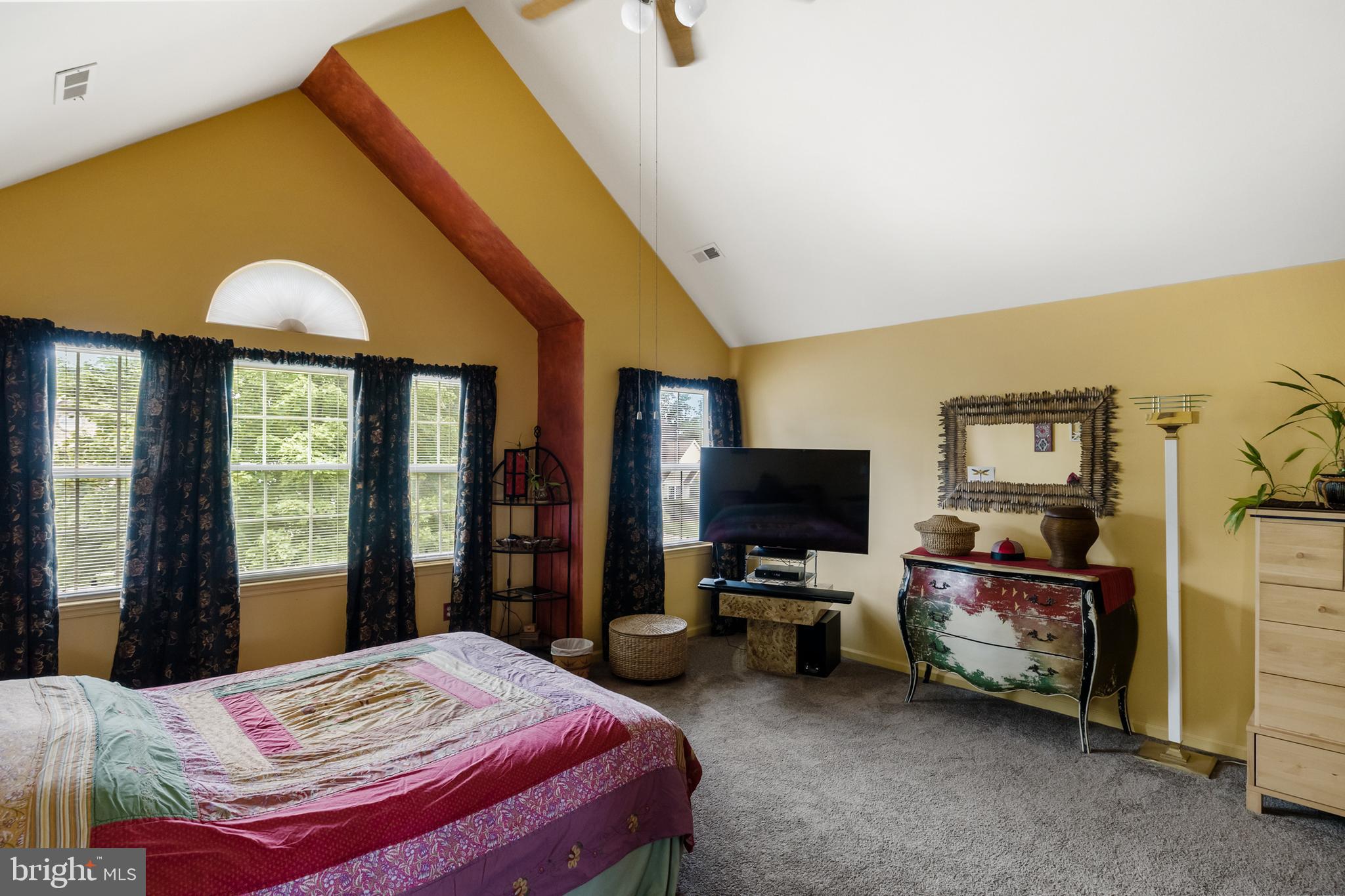 10 Tansgate Boulevard Berlin, NJ 08009 - Photo 24 of 51 a bedroom with a bed and a flat tv screen on dresser