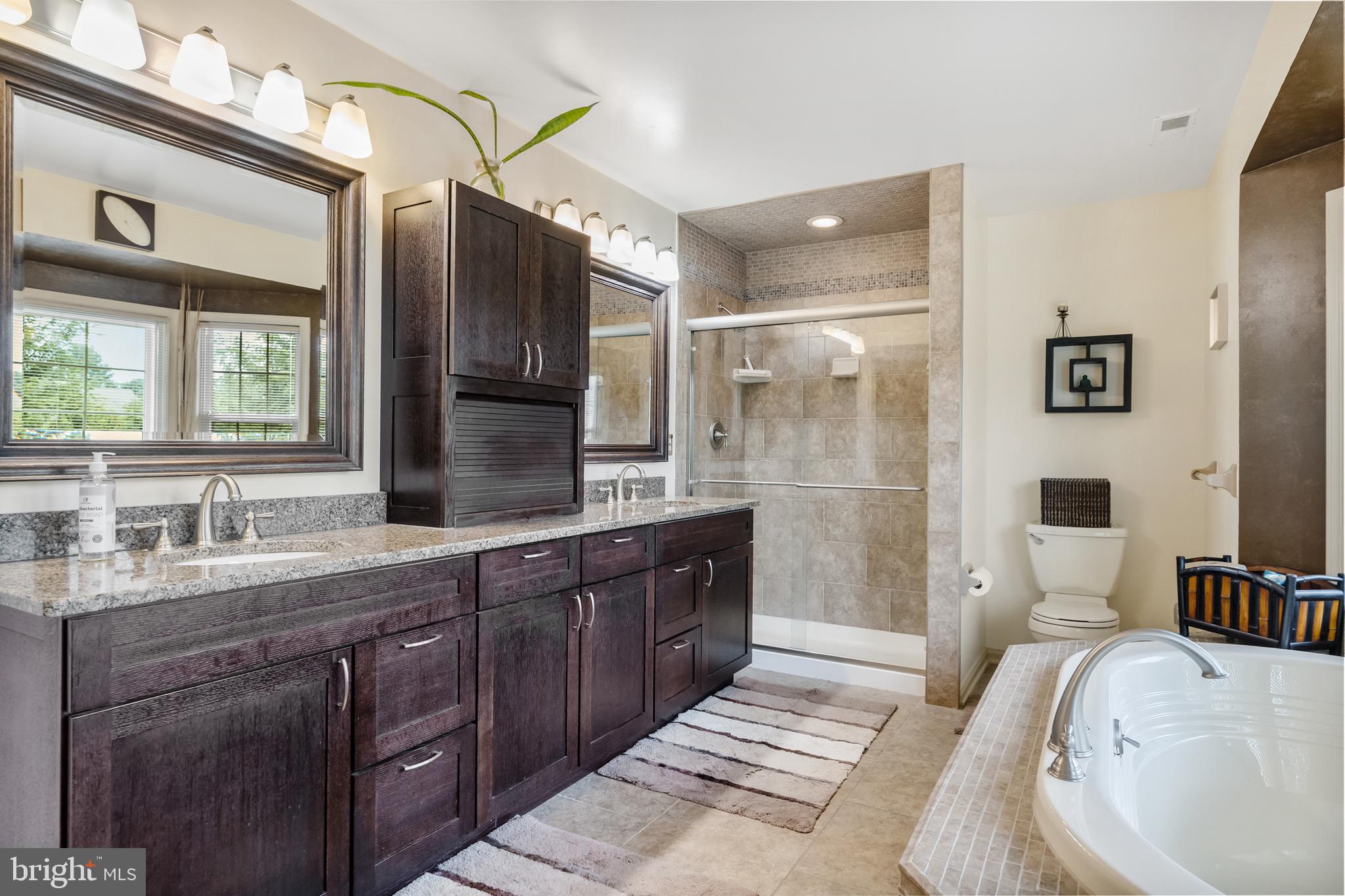 10 Tansgate Boulevard Berlin, NJ 08009 - Photo 28 of 51 a spacious bathroom with a tub sink and mirror