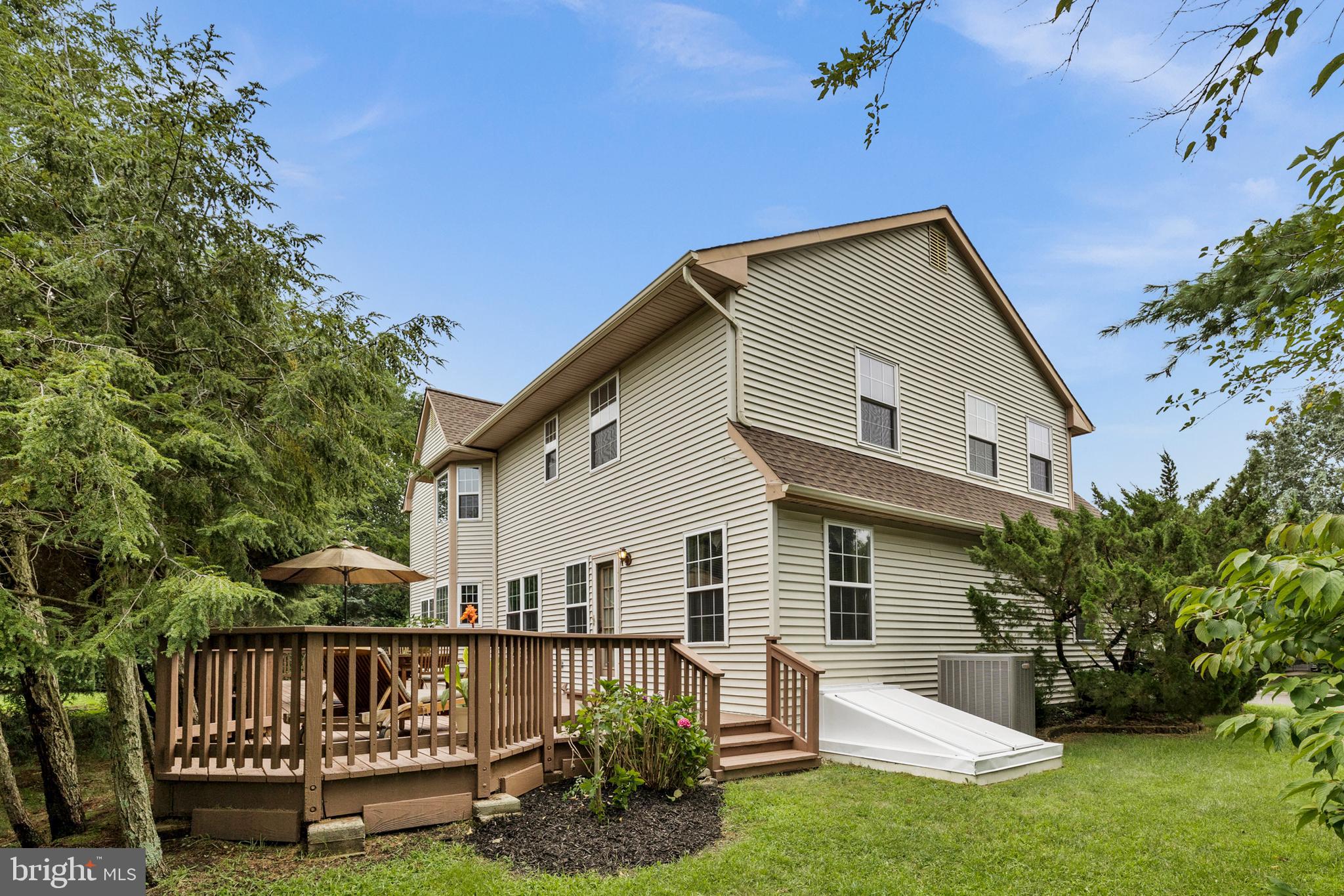 10 Tansgate Boulevard Berlin, NJ 08009 - Photo 42 of 51 a view of a house with a yard and plants