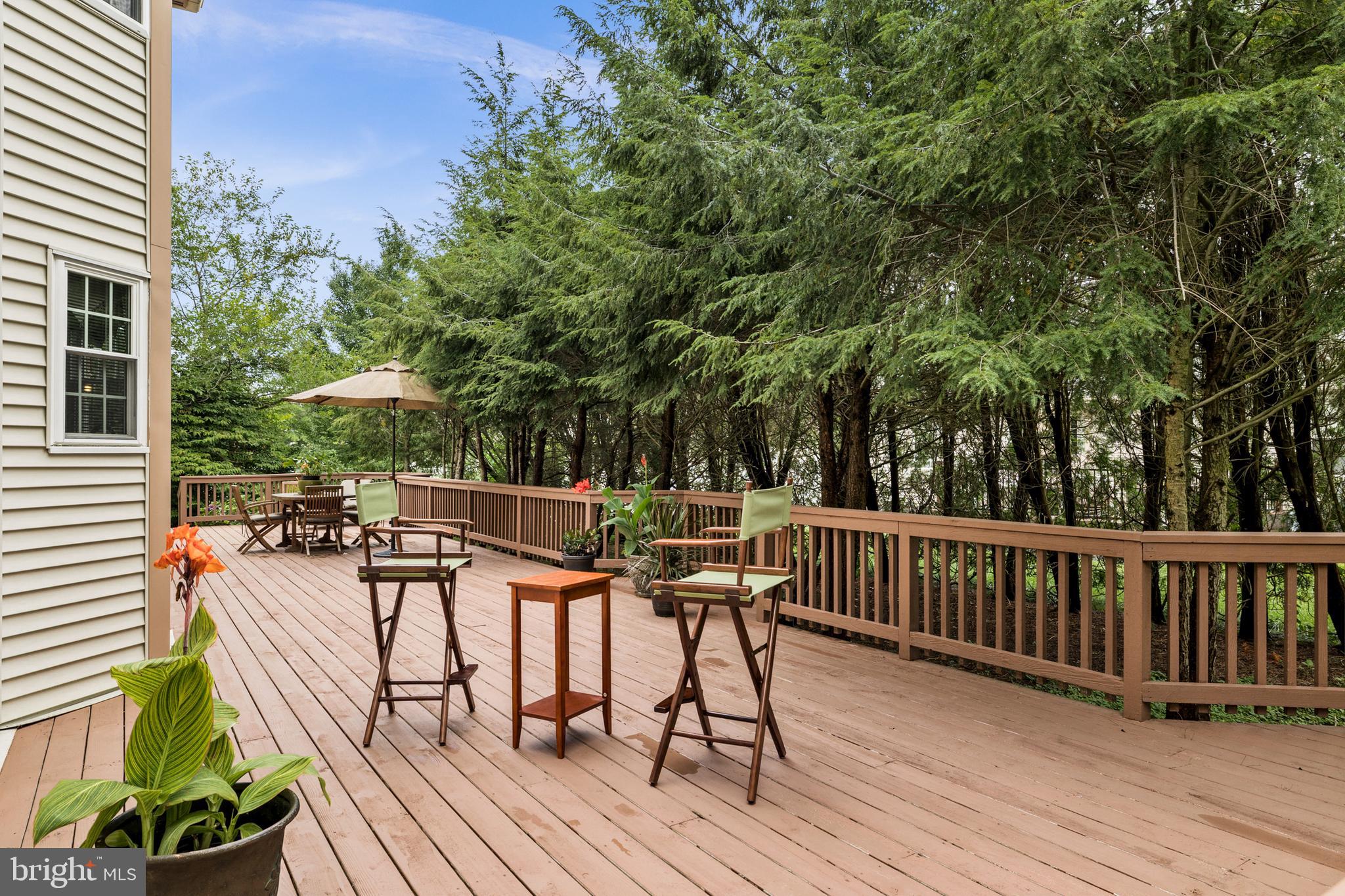 10 Tansgate Boulevard Berlin, NJ 08009 - Photo 44 of 51 a view of a table and chairs on the roof deck
