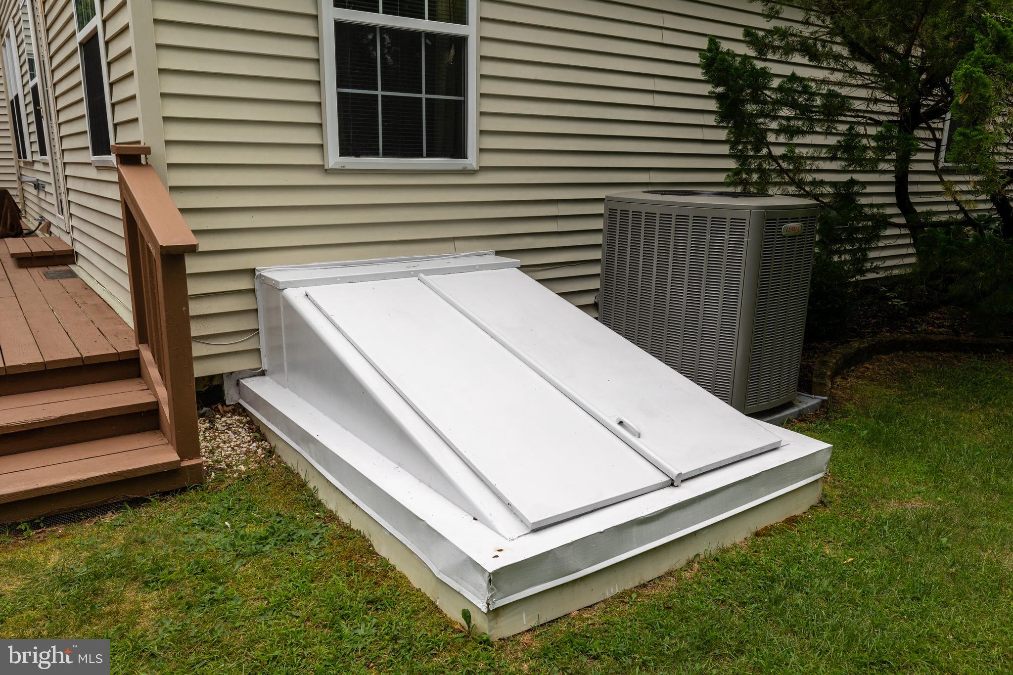10 Tansgate Boulevard Berlin, NJ 08009 - Photo 50 of 51 a white house with a small yard and wooden fence
