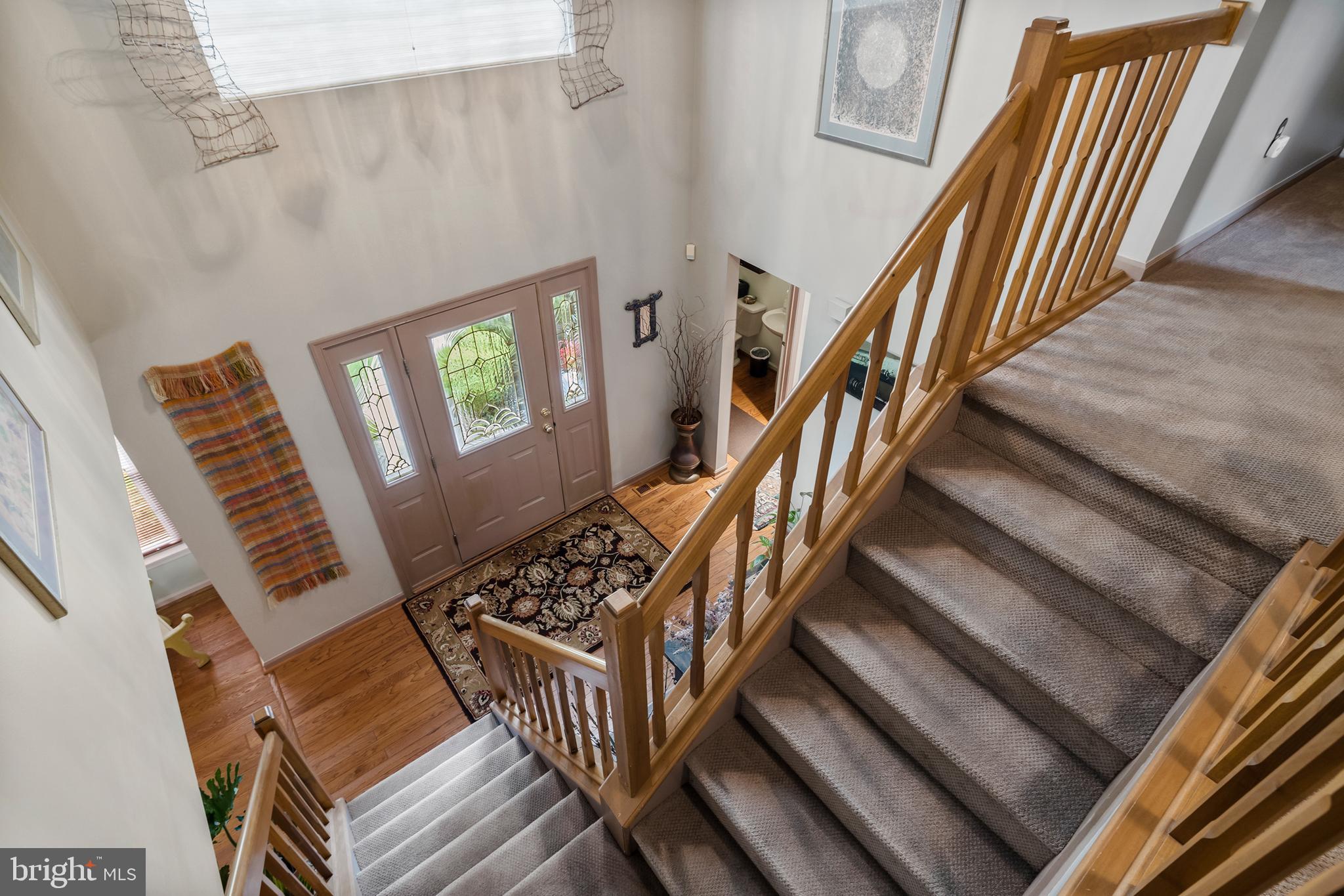 10 Tansgate Boulevard Berlin, NJ 08009 - Photo 7 of 51 a view of an entryway with wooden floor