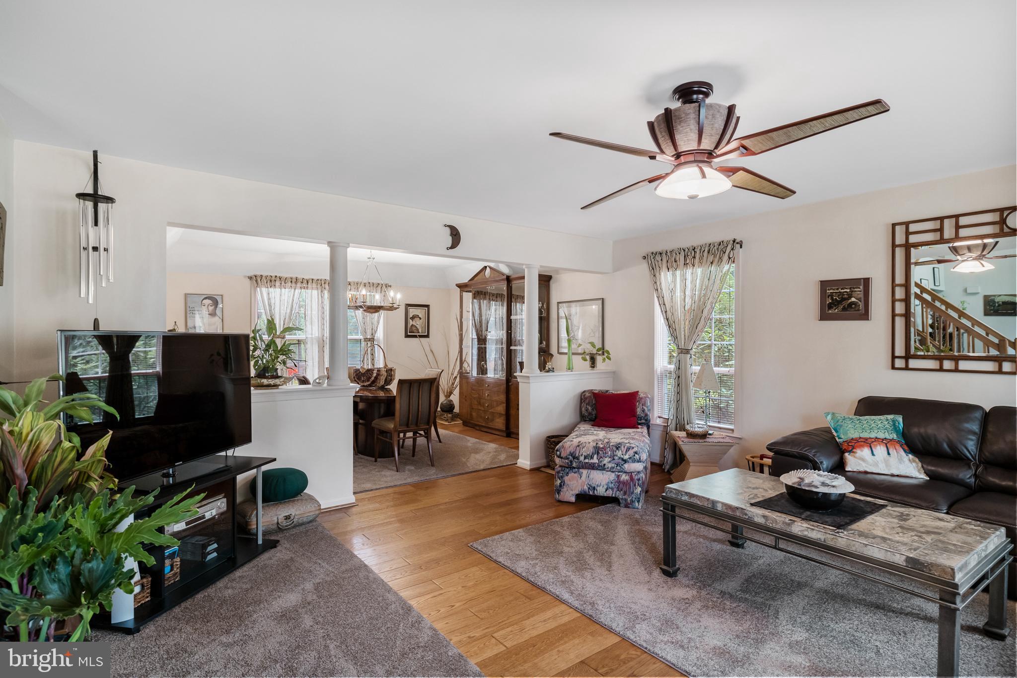 10 Tansgate Boulevard Berlin, NJ 08009 - Photo 8 of 51 a living room with furniture a window and a flat screen tv