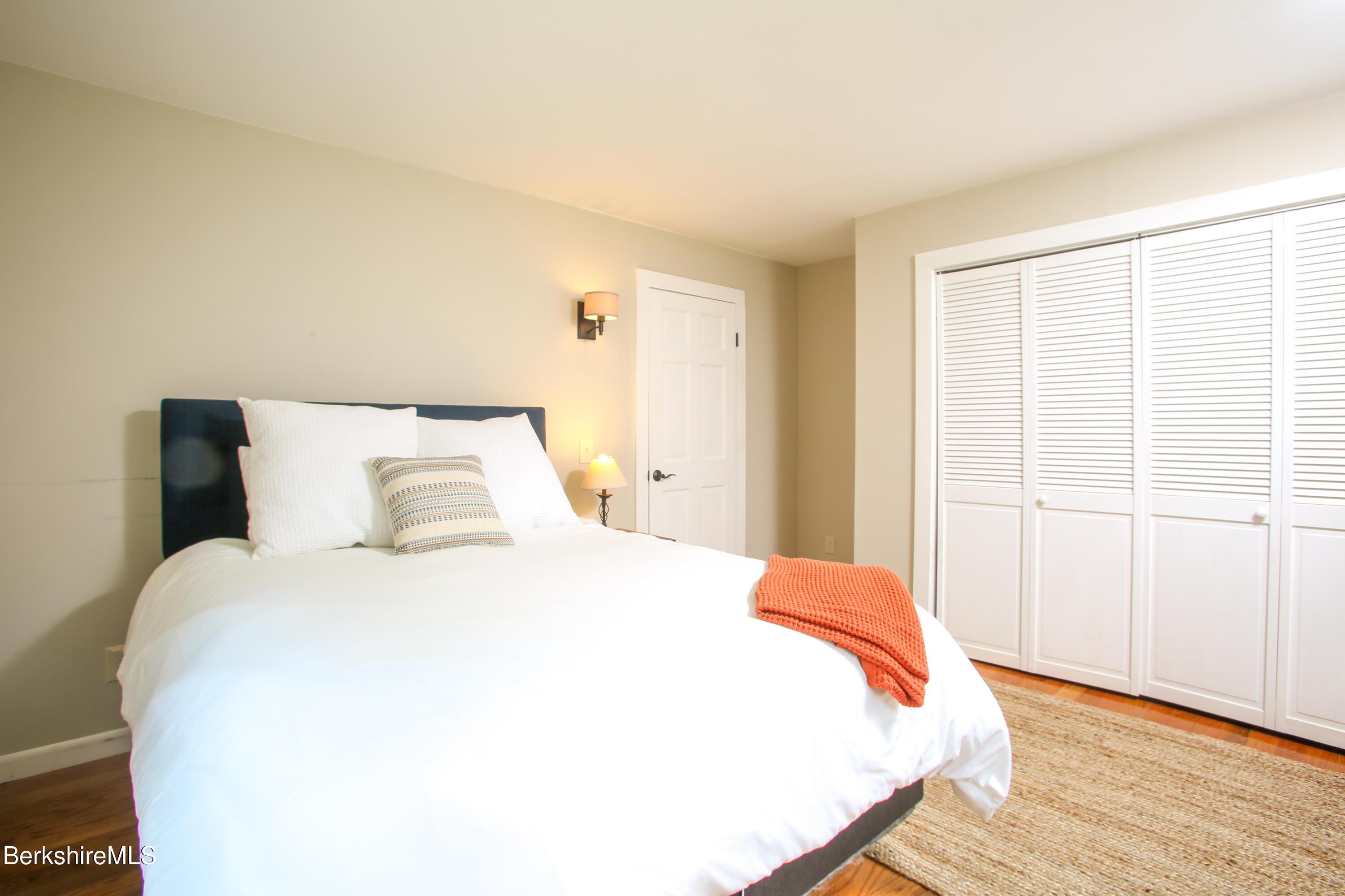127 County Road Rowe, MA 01367 - Photo 16 of 29 a bedroom with a bed and wooden floor