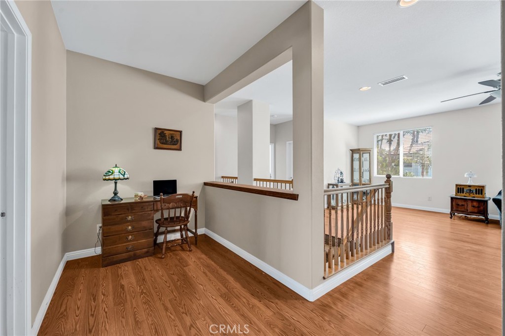 6874 Raspberry Court Eastvale, CA 92880 - Photo 18 of 36 a view of a workspace with furniture and entryway