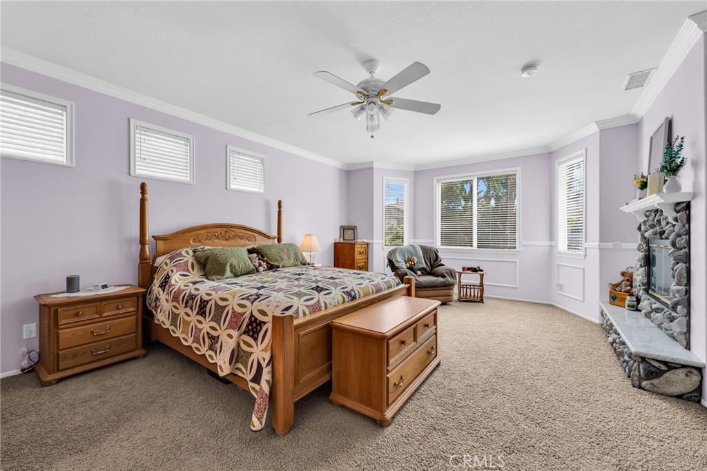 6874 Raspberry Court Eastvale, CA 92880 - Photo 23 of 36 a bedroom with a bed and a window