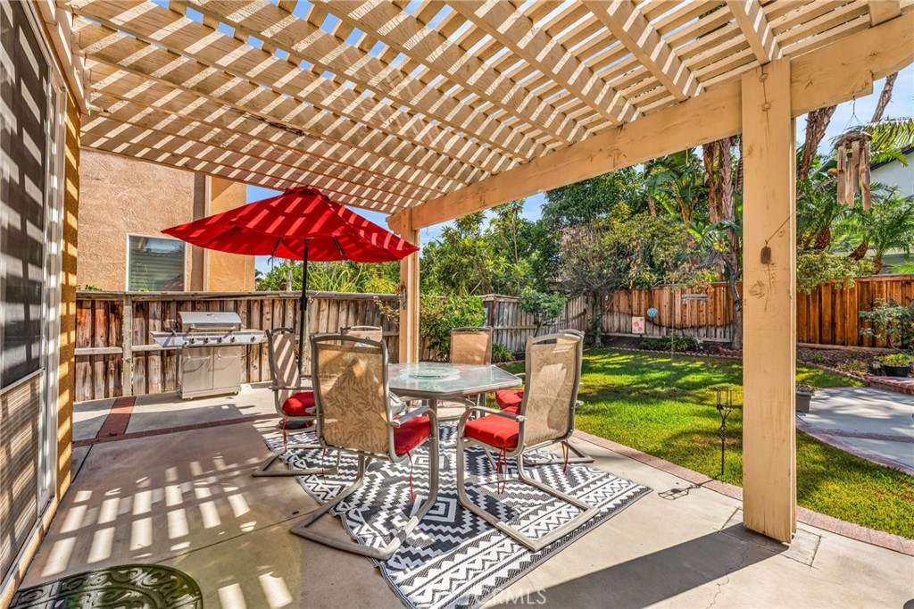 6874 Raspberry Court Eastvale, CA 92880 - Photo 29 of 36 a wooden bench sitting in front of a building