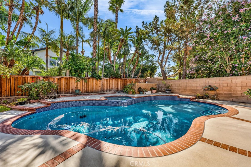 6874 Raspberry Court Eastvale, CA 92880 - Photo 31 of 36 a view of a swimming pool with a yard