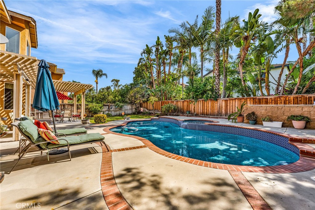 6874 Raspberry Court Eastvale, CA 92880 - Photo 33 of 36 a view of swimming pool with outdoor seating and plants
