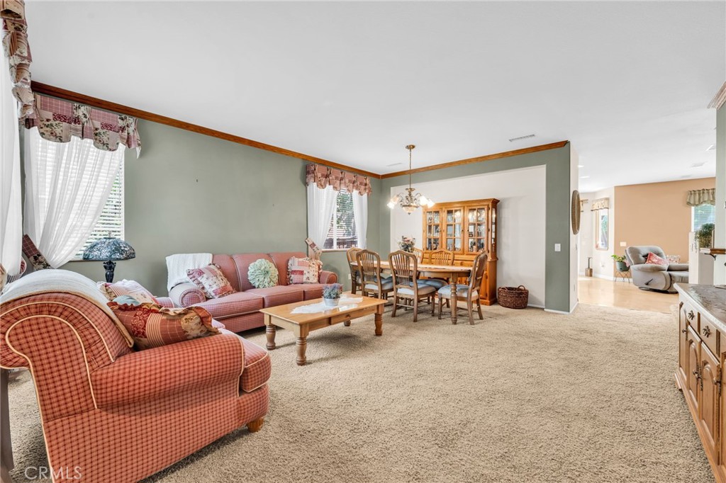 6874 Raspberry Court Eastvale, CA 92880 - Photo 5 of 36 a living room with furniture and a large window