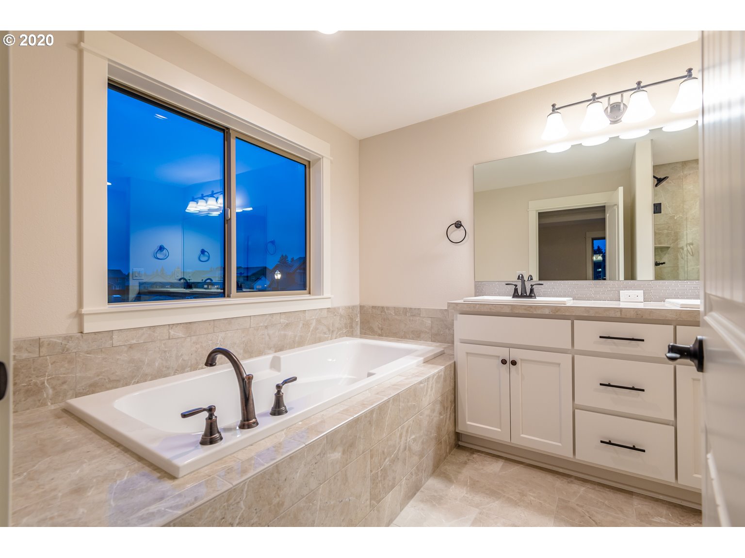 455 North 20th Place Ridgefield, WA 98642 - Photo 13 of 31 a bathroom with a sink vanity and mirror