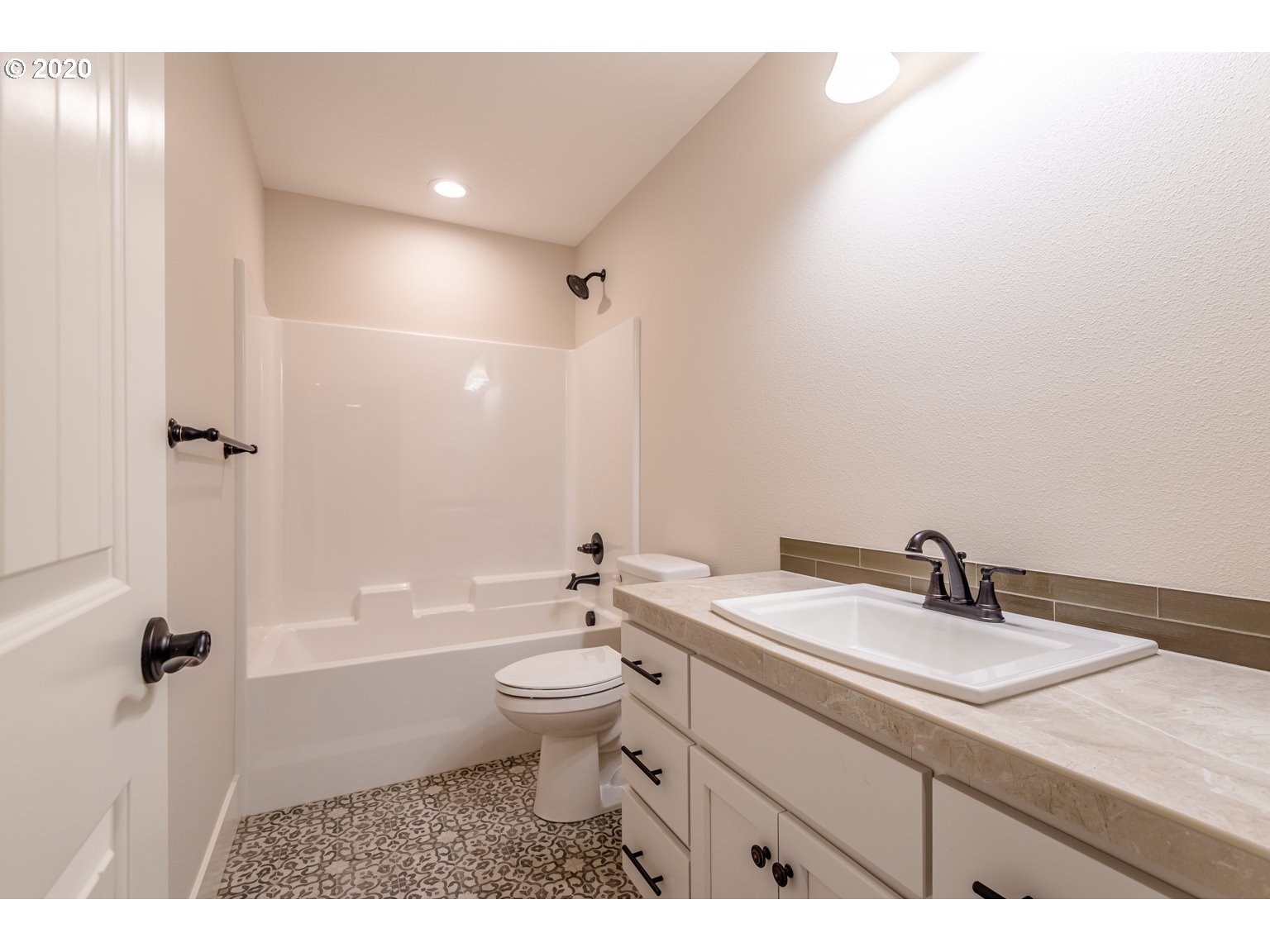 455 North 20th Place Ridgefield, WA 98642 - Photo 20 of 31 a bathroom with a granite countertop sink a toilet a mirror and bathtub