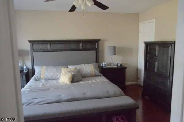 a bedroom with a bed and a lamp