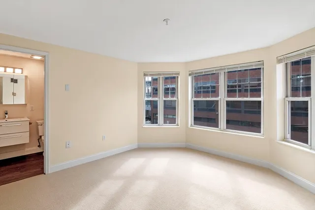 a bathroom with a toilet sink and shower