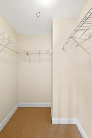 a view of an empty room with windows