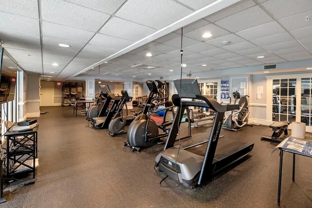 a living room with furniture a bookshelf and a bookshelf