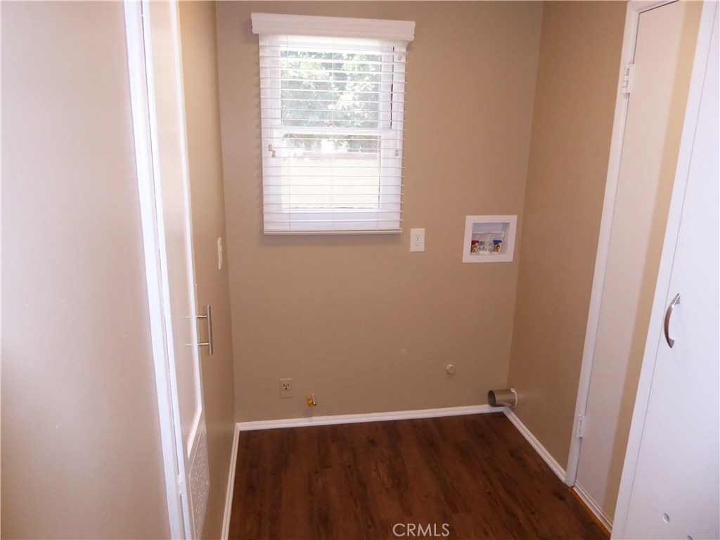 6735 Yellowstone Drive, Unit A Riverside, CA 92506 - Photo 12 of 21 an empty room with wooden floor and window
