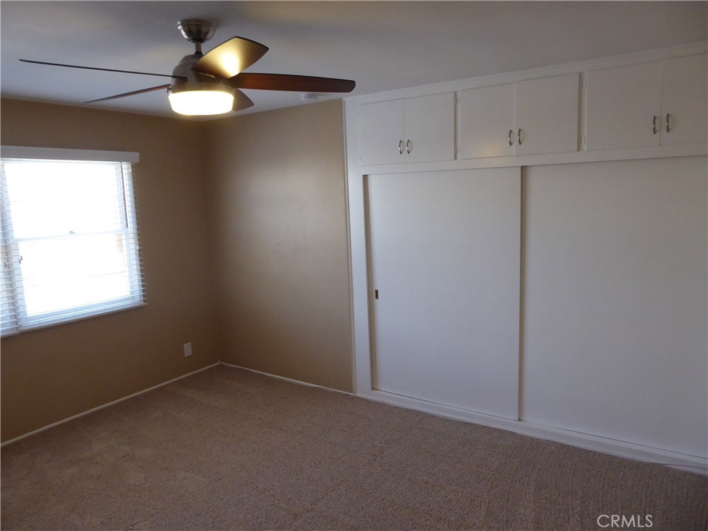 6735 Yellowstone Drive, Unit A Riverside, CA 92506 - Photo 15 of 21 an empty room with windows and fan