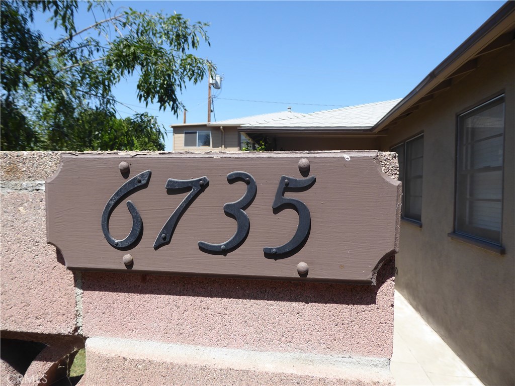 6735 Yellowstone Drive, Unit A Riverside, CA 92506 - Photo 3 of 14 a wooden bench sitting in front of a building