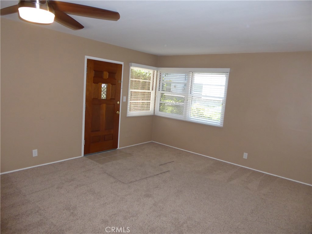 6735 Yellowstone Drive, Unit A Riverside, CA 92506 - Photo 6 of 21 an empty room with windows and cabinet