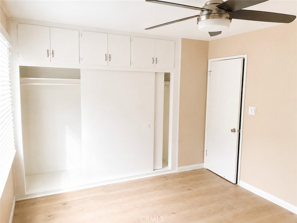 6735 Yellowstone Drive, Unit A Riverside, CA 92506 - Photo 9 of 14 a view of a kitchen with white cabinets and a refrigerator