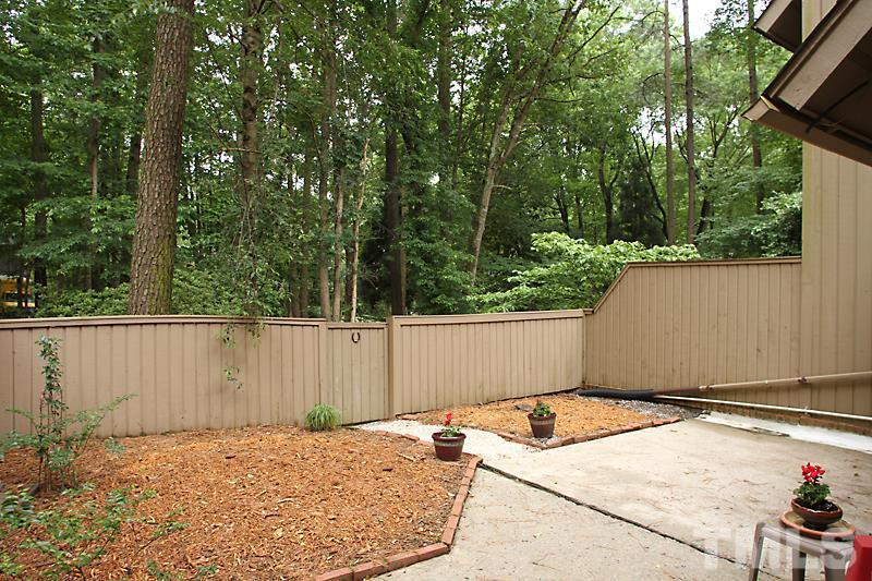 4307 Sun Belt Place Raleigh, NC 27613 - Photo 11 of 11 a backyard of a house with lots of green space
