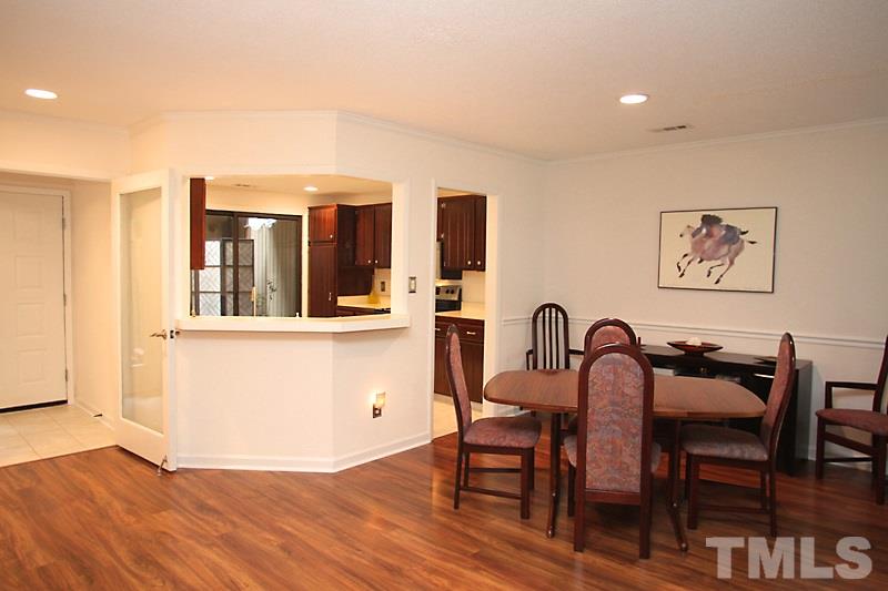 4307 Sun Belt Place Raleigh, NC 27613 - Photo 3 of 11 a view of a a dining room with furniture window and wooden floor