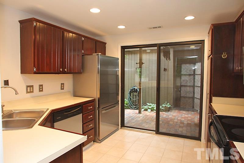 4307 Sun Belt Place Raleigh, NC 27613 - Photo 4 of 11 a kitchen with stainless steel appliances granite countertop a refrigerator and a sink