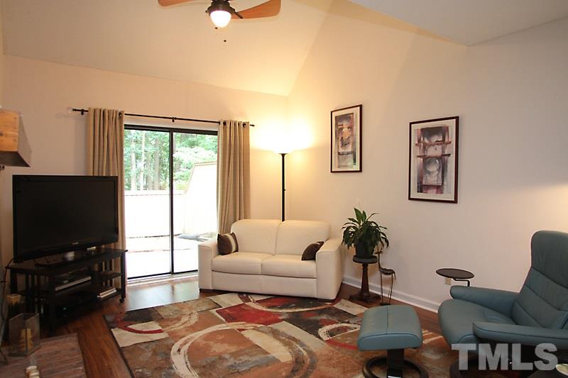 4307 Sun Belt Place Raleigh, NC 27613 - Photo 6 of 11 a living room with furniture and a flat screen tv