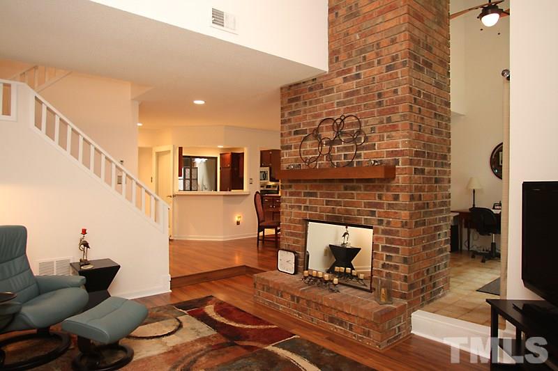 4307 Sun Belt Place Raleigh, NC 27613 - Photo 7 of 11 a living room with furniture and a fireplace