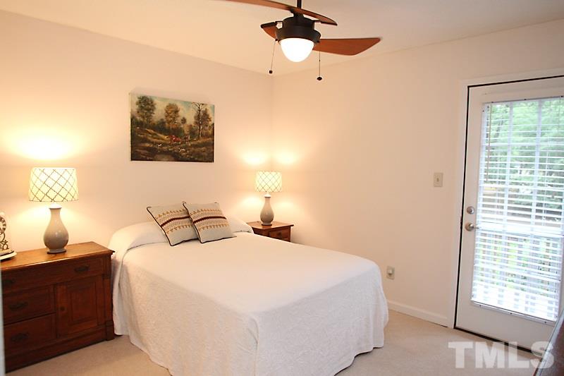 4307 Sun Belt Place Raleigh, NC 27613 - Photo 8 of 11 a bedroom with a bed and a window