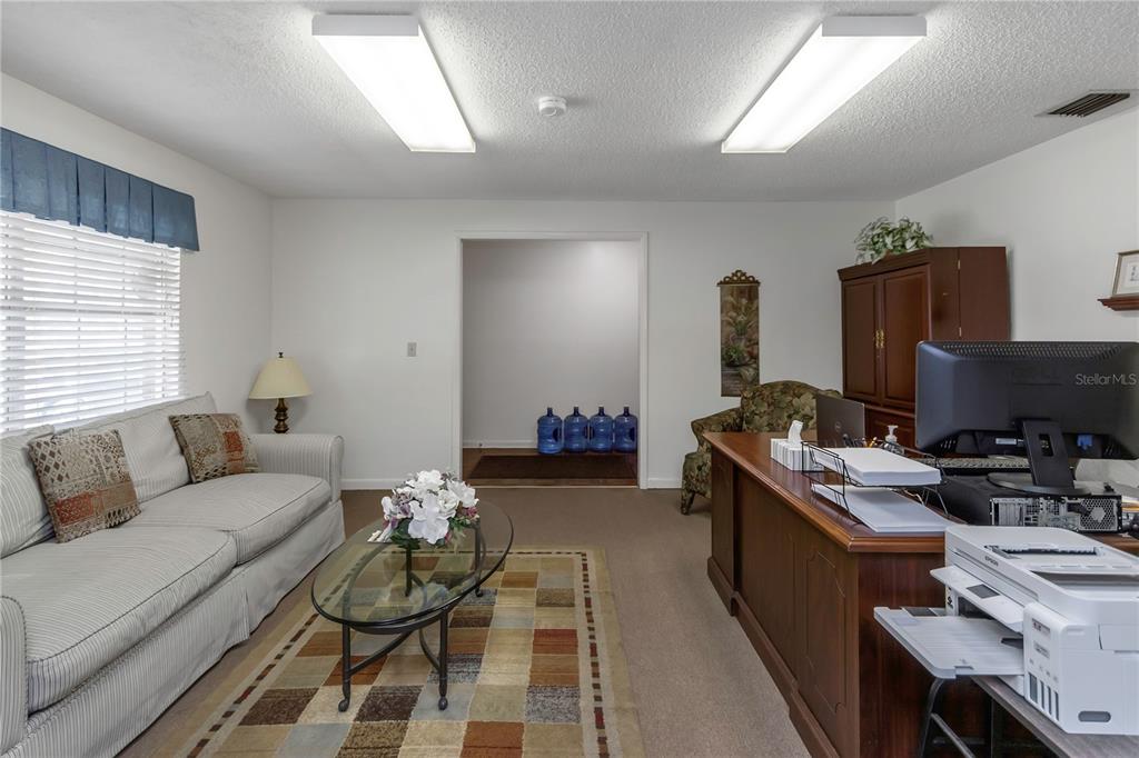 17515 Lakeshore Road Lutz, FL 33558 - Photo 12 of 61 a livingroom with workspace and a couch
