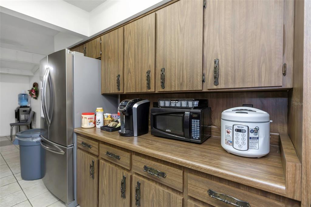 17515 Lakeshore Road Lutz, FL 33558 - Photo 18 of 61 a kitchen with a stove and a white cabinets