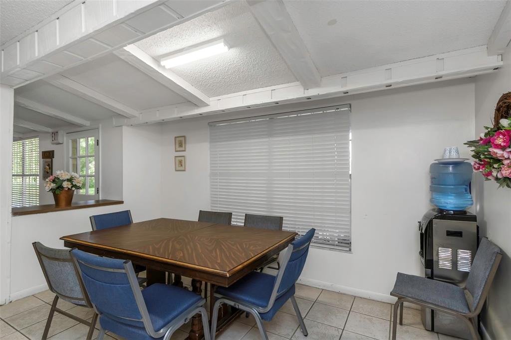 17515 Lakeshore Road Lutz, FL 33558 - Photo 21 of 61 a view of a dining room with furniture