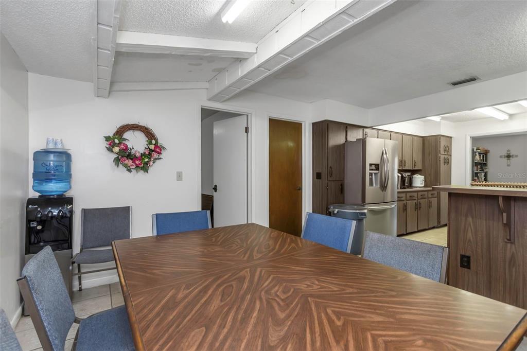 17515 Lakeshore Road Lutz, FL 33558 - Photo 22 of 61 a bedroom with a bed and a view of kitchen