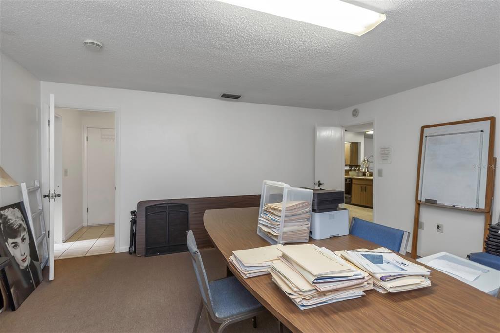 17515 Lakeshore Road Lutz, FL 33558 - Photo 29 of 61 a living room with furniture and a table