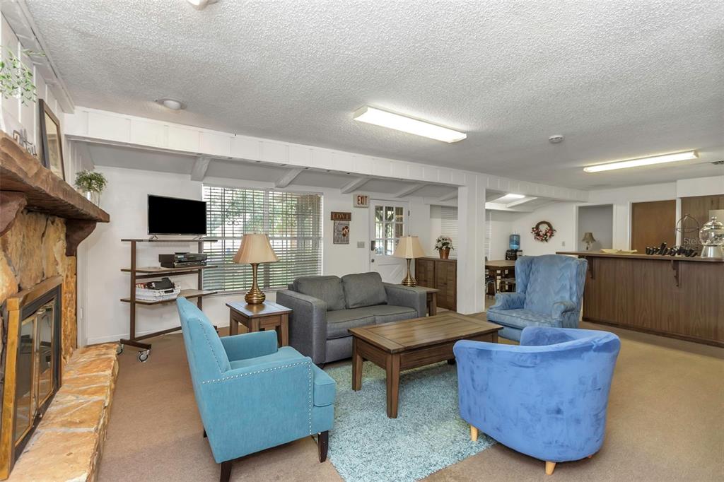 17515 Lakeshore Road Lutz, FL 33558 - Photo 31 of 61 a living room with furniture and a flat screen tv