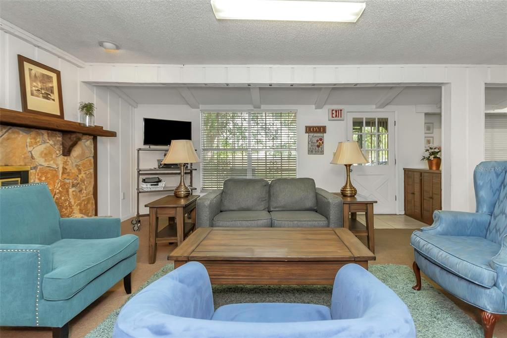 17515 Lakeshore Road Lutz, FL 33558 - Photo 34 of 61 a living room with furniture and a flat screen tv