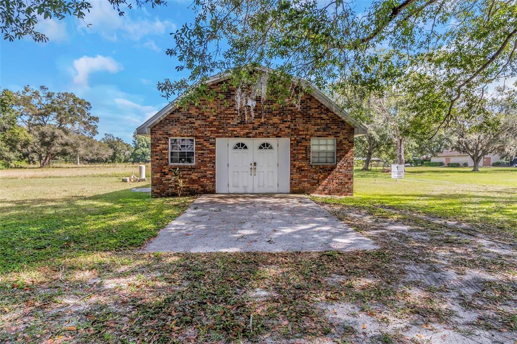 17515 Lakeshore Road Lutz, FL 33558 - Photo 48 of 61 a view of a house with a yard