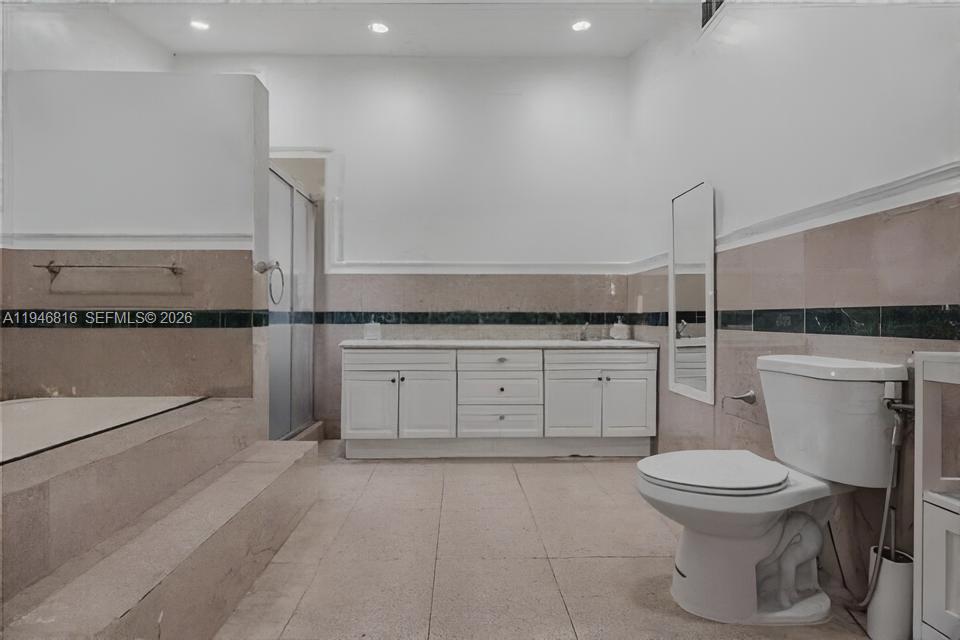 10351 Southwest 49th Street, Unit MAIN Miami, FL 33165 - Photo 16 of 21 a bathroom with a toilet and a sink