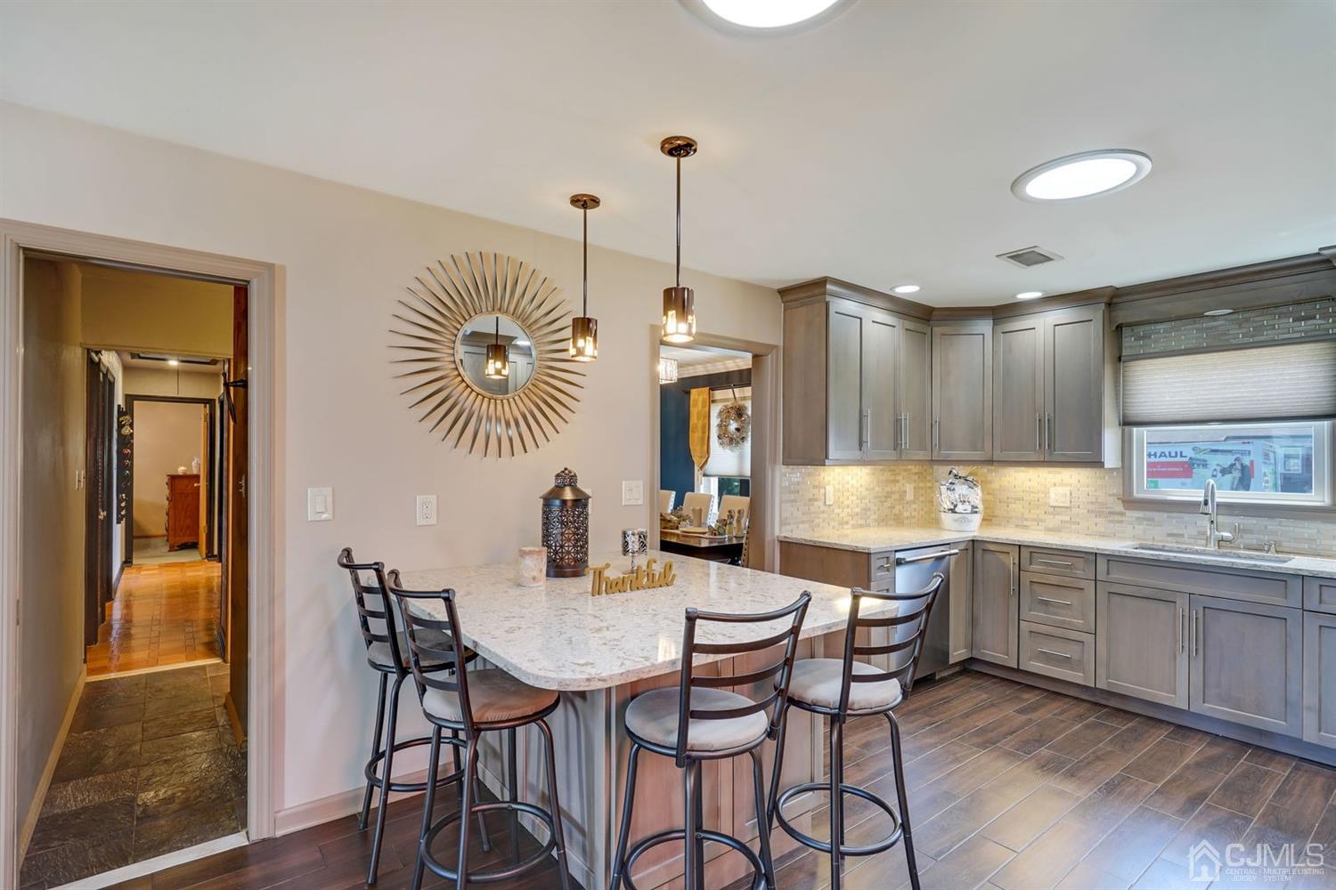 41 Cambridge Road Edison, NJ 08817 - Photo 22 of 42 a kitchen with a table and chairs in it