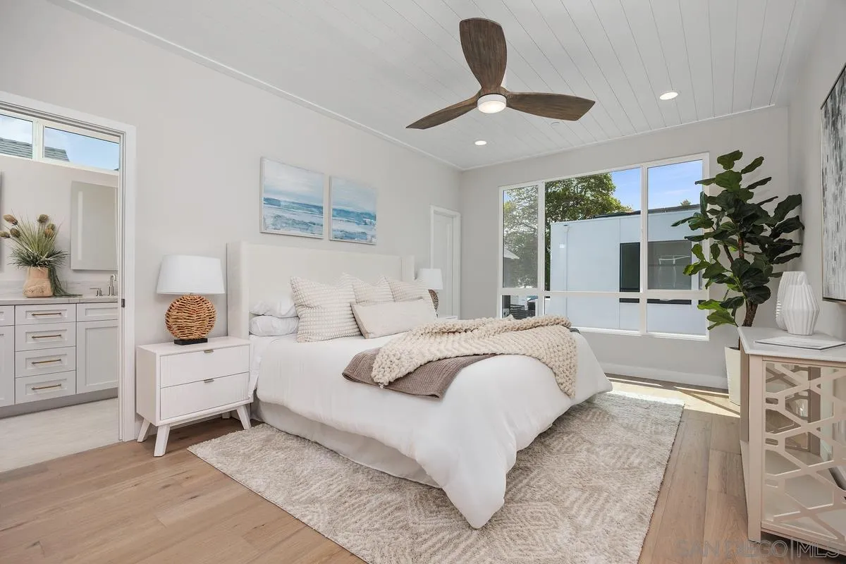 559 North Vulcan Avenue Encinitas, CA 92024 - Photo 23 of 50 a bedroom with a large bed and a window