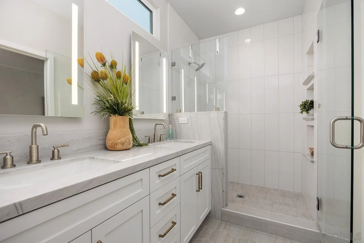 559 North Vulcan Avenue Encinitas, CA 92024 - Photo 25 of 50 a bathroom with a shower sink and mirror